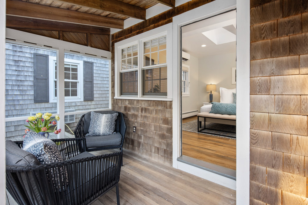 martha's vineyard hotel guest room with patio and bed