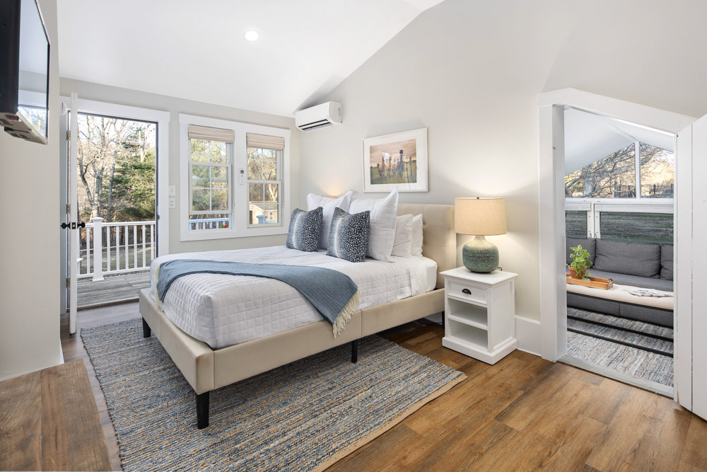 martha's vineyard hotel guest room with patio and bed