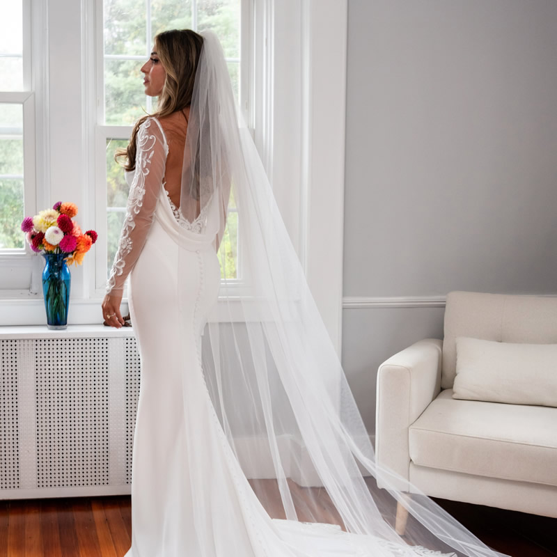 brittney wedding dress by window